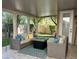 Covered patio with comfortable seating area and a fire pit, perfect for outdoor living at 1812 Warrenville St, Las Vegas, NV 89117