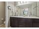 Bathroom with dual sinks, a big mirror, and mosaic tile accents on the backsplash providing lots of space at 1922 Via Delle Arti, Henderson, NV 89044