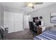 Bedroom with closet, gray carpeting and modern desk setup at 1922 Via Delle Arti, Henderson, NV 89044