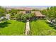 Aerial showcases a lush lawn and grand clubhouse, hinting at community amenities and inviting atmosphere at 1922 Via Delle Arti, Henderson, NV 89044