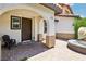 Charming front porch with brick flooring, comfortable seating, and a welcoming entrance at 1922 Via Delle Arti, Henderson, NV 89044