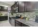 Gourmet kitchen featuring stainless steel appliances and granite countertops at 1922 Via Delle Arti, Henderson, NV 89044