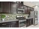 Well-equipped kitchen with stainless steel appliances and stylish backsplash at 1922 Via Delle Arti, Henderson, NV 89044