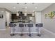 Modern kitchen with granite countertops, stainless steel appliances, and a convenient breakfast bar at 1922 Via Delle Arti, Henderson, NV 89044
