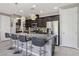Well-equipped kitchen with a breakfast bar, stainless steel appliances, and ample cabinet space at 1922 Via Delle Arti, Henderson, NV 89044