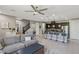 Bright living room flows into an open kitchen with a cozy gray sofa and stylish decor at 1922 Via Delle Arti, Henderson, NV 89044