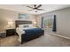 Comfortable main bedroom with neutral tones, ceiling fan, and ample natural light at 1922 Via Delle Arti, Henderson, NV 89044