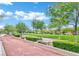 Serene park featuring a bocce ball court surrounded by lush greenery and walking paths at 1922 Via Delle Arti, Henderson, NV 89044