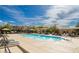 Upscale pool surrounded by lounge chairs and cabanas, ideal for relaxation and entertainment at 1922 Via Delle Arti, Henderson, NV 89044