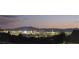 Panoramic city view of Las Vegas at night, showcasing the vibrant skyline against a backdrop of mountains at 2050 N Los Feliz St # 170, Las Vegas, NV 89156