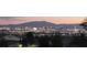 Distant city view featuring city lights, trees, and mountain backdrop at 2050 N Los Feliz St # 170, Las Vegas, NV 89156