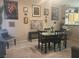 Inviting dining area featuring a dark wood table set, unique artwork, and neutral color scheme at 2050 N Los Feliz St # 170, Las Vegas, NV 89156