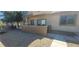 Apartment exterior showing front door, small patio with block wall, and desert landscaping at 2050 N Los Feliz St # 170, Las Vegas, NV 89156