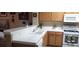 Kitchen with tile countertops and white appliances at 2050 N Los Feliz St # 170, Las Vegas, NV 89156