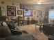 Raiders themed living room with comfortable seating, ceiling fan, and television at 2050 N Los Feliz St # 170, Las Vegas, NV 89156