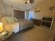 Main bedroom featuring a dresser, comfortable bed, and neutral decor at 2050 N Los Feliz St # 170, Las Vegas, NV 89156
