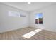 Bright room featuring wood-look flooring and window with backyard view at 2105 Berkley Ave, Las Vegas, NV 89101