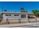 Well-maintained single-story home featuring a white picket fence at 2105 Berkley Ave, Las Vegas, NV 89101