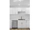 Updated kitchen with white cabinets, quartz countertops and stainless steel dishwasher at 2105 Berkley Ave, Las Vegas, NV 89101