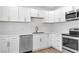 Bright kitchen with white cabinets, stainless steel appliances and gold hardware at 2105 Berkley Ave, Las Vegas, NV 89101