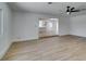 Open-concept living room with wood floors leading to the kitchen at 212 View Dr, Las Vegas, NV 89107