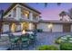 Spacious outdoor patio with a fire pit, comfortable seating, and manicured landscaping, perfect for outdoor enjoyment at 2285 Villefort Ct, Las Vegas, NV 89117