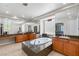 Luxurious bathroom featuring a soaking tub with granite surround, dual sinks, and large mirrors at 2285 Villefort Ct, Las Vegas, NV 89117
