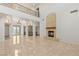 An expansive foyer with a fireplace and an upper level balcony at 2285 Villefort Ct, Las Vegas, NV 89117