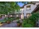 Elegant home exterior with a stone facade, manicured landscaping, and a welcoming entrance at 2285 Villefort Ct, Las Vegas, NV 89117