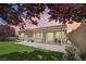 Relaxing backyard with covered patio and well-maintained synthetic lawn at 2297 Aria Dr, Henderson, NV 89052