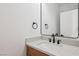Elegant half bathroom features a modern sink and a framed rectangular mirror at 2297 Aria Dr, Henderson, NV 89052