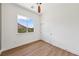 Bedroom featuring a ceiling fan, a large window, and a closet with sliding doors at 2297 Aria Dr, Henderson, NV 89052