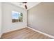 Bedroom with ceiling fan and large window with bright natural light at 2297 Aria Dr, Henderson, NV 89052