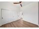 Bright bedroom features a ceiling fan and a closet with double doors at 2297 Aria Dr, Henderson, NV 89052