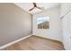 Bedroom with ceiling fan, window views, and a closet with sliding doors at 2297 Aria Dr, Henderson, NV 89052