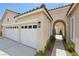 Beautiful home featuring a three-car garage, tiled roof, and desert landscaping at 2297 Aria Dr, Henderson, NV 89052