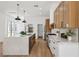 Modern kitchen boasts a large center island, stainless steel appliances, and ample countertop space at 2297 Aria Dr, Henderson, NV 89052