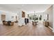 Open-concept living room features wood floors, recessed lighting and adjoins dining area at 2297 Aria Dr, Henderson, NV 89052