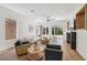 Bright, open living room with modern fireplace, recessed lighting, and sliding doors to the backyard at 2297 Aria Dr, Henderson, NV 89052
