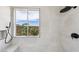 Sleek shower with black fixtures and a view offers a spa-like experience at 2297 Aria Dr, Henderson, NV 89052