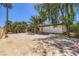 Expansive backyard space with mature palm trees providing ample shade at 2770 La Casita Ave, Las Vegas, NV 89120