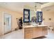 Bright bathroom features a granite countertop, modern sink, blue cabinetry, and a door to the exterior at 2770 La Casita Ave, Las Vegas, NV 89120