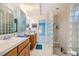 Bathroom featuring double sinks, tile floor, and a glass block shower at 2770 La Casita Ave, Las Vegas, NV 89120
