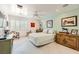 Bright bedroom featuring tile floors, ceiling fan, white trim and shutters, and equestrian themed decor at 2770 La Casita Ave, Las Vegas, NV 89120