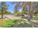 Paddock featuring horse, surrounded by shady trees, green lawns, and a white perimeter fence at 2770 La Casita Ave, Las Vegas, NV 89120