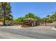 Community gated entrance with a guard house and manicured landscaping providing security and curb appeal at 2770 La Casita Ave, Las Vegas, NV 89120