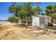 Exterior of horse stables with attached kennels and sandy areas for horses at 2770 La Casita Ave, Las Vegas, NV 89120