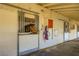 Horse peers out from stall at Sierra Vista Ranchos, equipped with viewing window and metal bars at 2770 La Casita Ave, Las Vegas, NV 89120