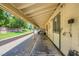 Long shot of the exterior of the horse stalls and shaded walkway at Sierra Vista Ranchos at 2770 La Casita Ave, Las Vegas, NV 89120
