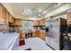 Kitchen featuring stainless steel appliances, a corner sink, lots of light, and abundant wood cabinetry at 2770 La Casita Ave, Las Vegas, NV 89120